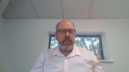 A person in a white shirtDescription automatically generated