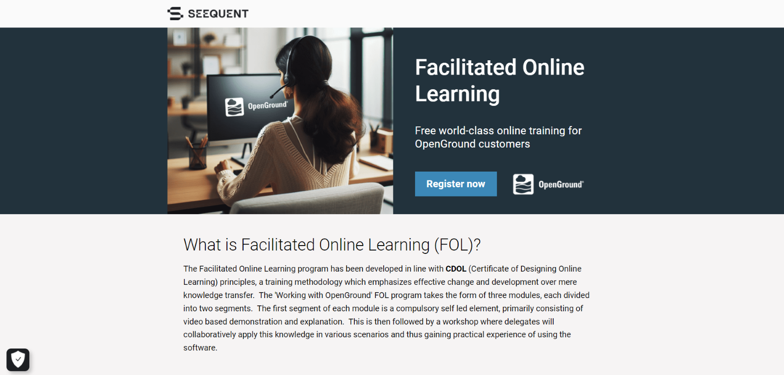 A person sitting at a desk with a headsetDescription automatically generated